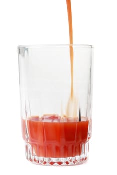 tomato juice in a glass, isolated on white
