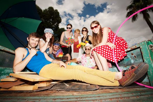 Groovy Group in the Back of Truck Smiling