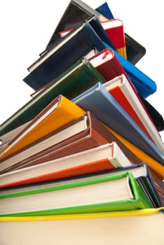 Tower of books one over the other isolated on white