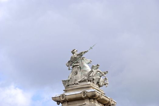 A Statue of a Woman in a Horse Drawn Chariot holding a Trident