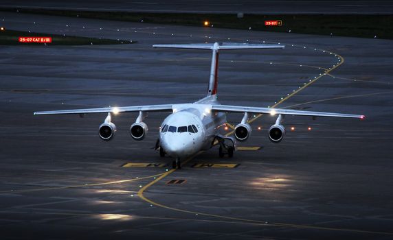 landing plane on the airport in the afternoon