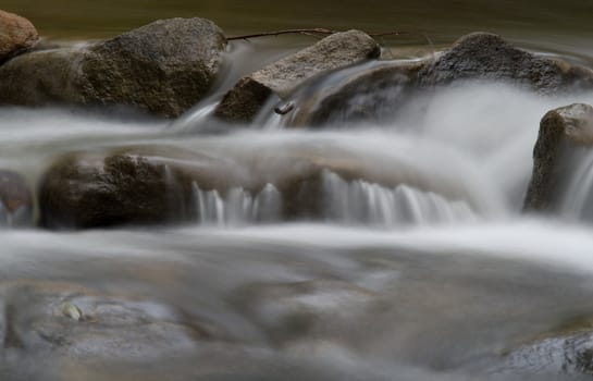 beautiful soft water over rocks in the stream