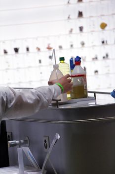 chemical laboratory with yellow liquid and bottles