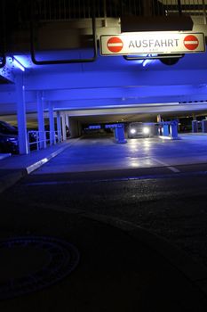 parking garage with bright neon lights at night