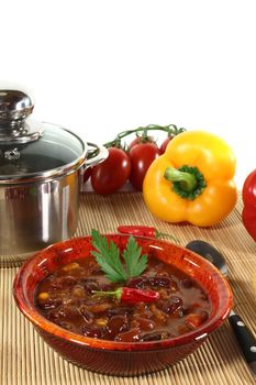 Chili con carne with kidney beans, beef, peppers and parsley