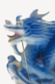 Acupuncture needle with a dragon