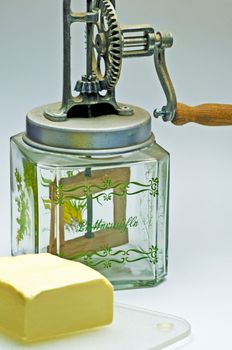 butter churn with a pice of butter