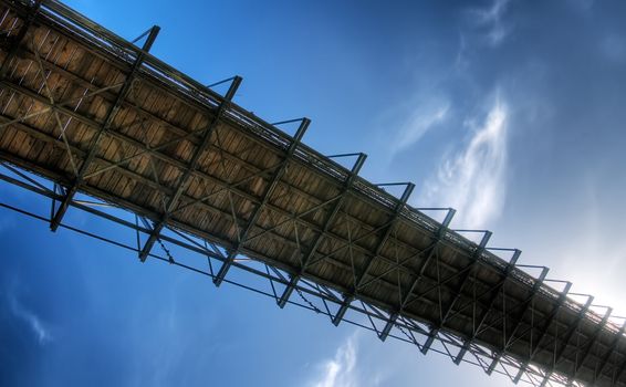 It is a bridge over blue sky.