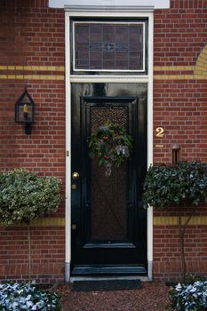 Dutch frontdoor with christmas ornaments in december