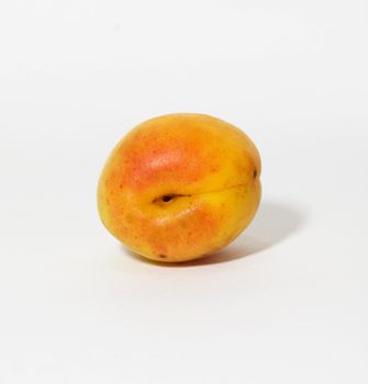 Fresh and ripe apricot isolated on a white background 