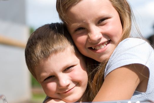 The brother and sister on summer vacations.  A warm sunny day in village
