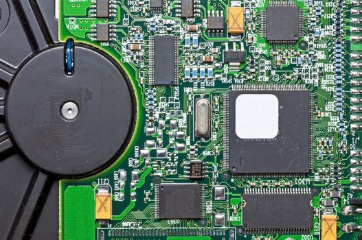 computer hard disk closeup to a circuit board
