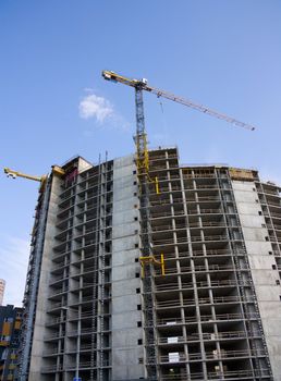 crane at a construction site, a blue sky