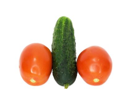 two tomatoes were insulated and one cucumber on white