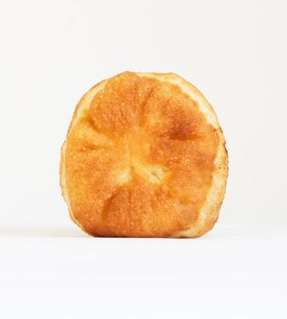 One oven baked pasty over white background. Looks delicious. 