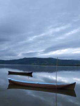 Tow boats at a lagoon at the early morning.