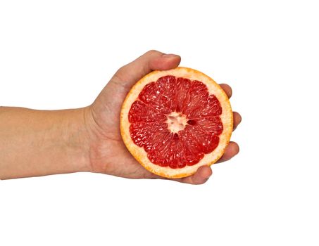 Half of grapefruit in female hand. Isolation. 