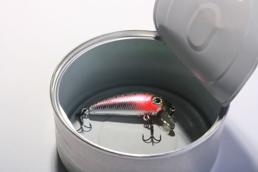 Open can with the spoon hook for fishing.