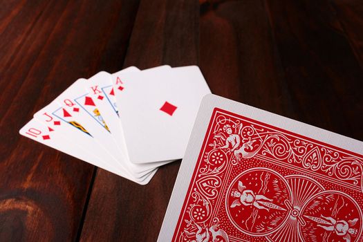 Game in poker, cards on a table, the player is going to hand over a card.
