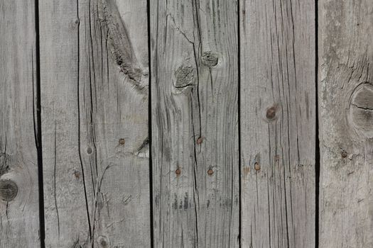 Close up of gray wooden fence panels 