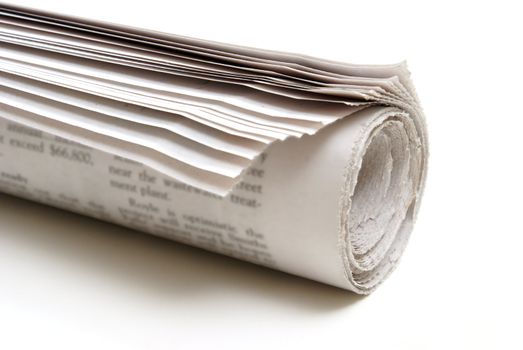 A rolled up newspaper on a white background.