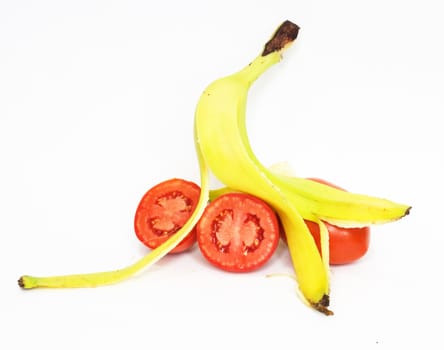 Banana skin and tomatoes insulated on white background