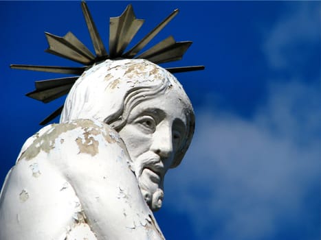 A detail of a stone statue portraying 'The Scourging of Christ' which is found on a hilltop in Siggiewi, Malta.