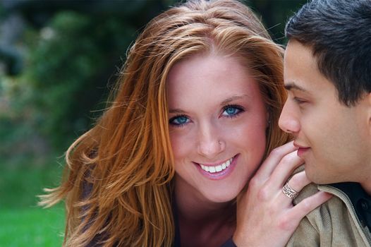 Young couple in an autumn forest picnic area