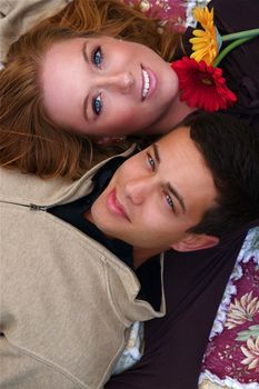 Young couple in an autumn forest picnic area