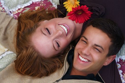 Young couple in an autumn forest picnic area