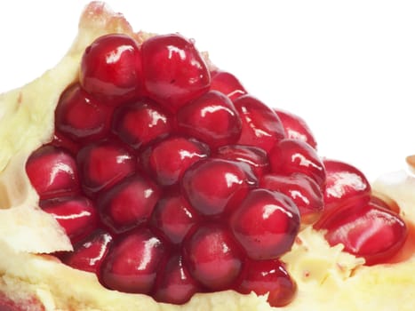 Extreme close up background of a red juicy ripe pomegranate fruit seeds 