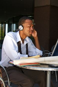 Young Businessman works on a computer outdoors