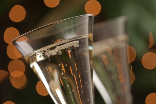 Champagne Glasses Abstract with Sparkling Lights in the Background.