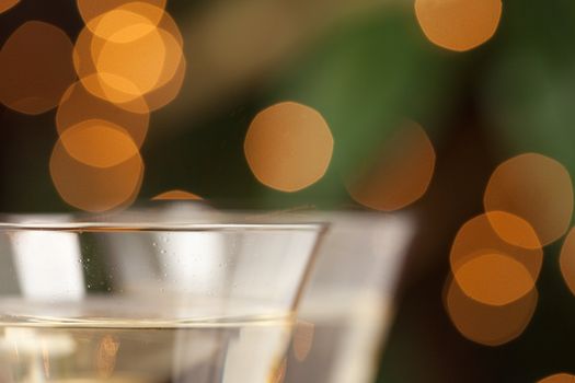 Champagne Glasses Abstract with Sparkling Lights in the Background.