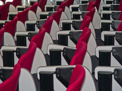 lines of red chairs in the meeting room.