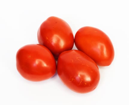 Four ripe tomatoes isolated on white background 