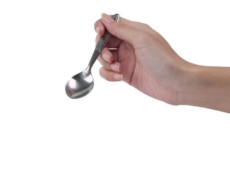 Spoon in hand on white background