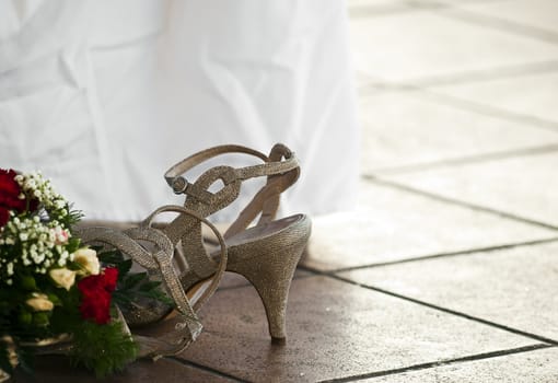 Detail and still life shot of bridesmaid's shoe lying on the floor