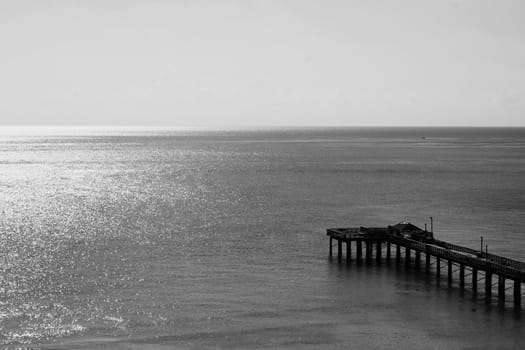 Big long pier on a sunny day.