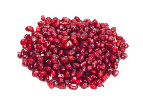 Extreme close up background of a red juicy ripe pomegranate fruit seeds 