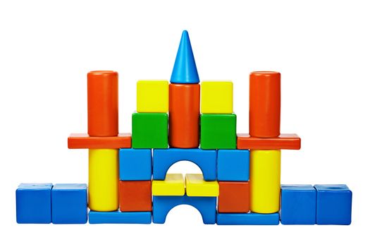 The castle was built from colored toy blocks isolated on white background