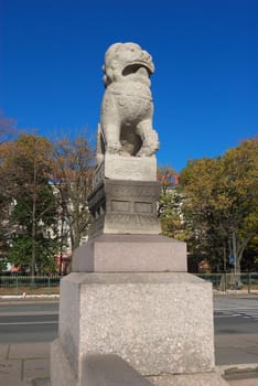 photo of the lion statue costing on pedistal