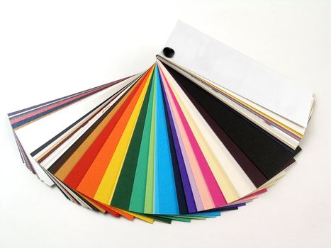 Colored samples of different papers on white background, business cards