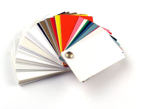 Colored samples of different papers on white background, business cards