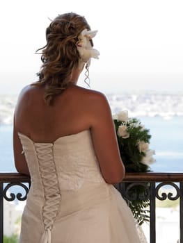 A newly wed bride showing bridal gown detail