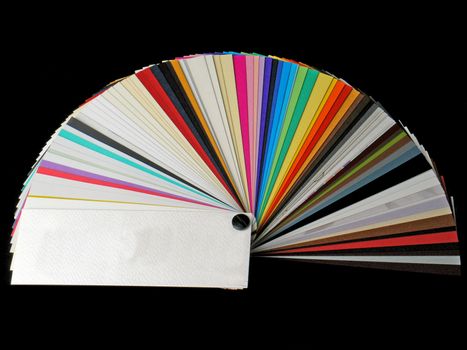 Colored samples of different papers on white background, business cards