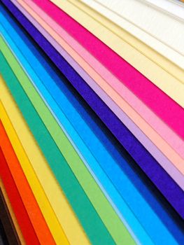 Colored samples of different papers on white background, business cards