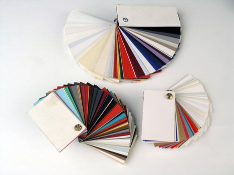 Colored samples of different papers on white background