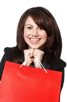 An crazy happy shopping girl holding bags and filled with glee.
