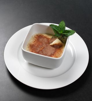 An image of a bowl of Tiramisu.
